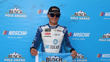 BRISTOL, TN - AUGUST 17: Kyle Larson, driver of the #42 DC Solar Chevrolet, poses with the pole award after qualifying for the Monster Energy NASCAR Cup Series Bass Pro Shops NRA Night Race at Bristol Motor Speedway on August 17, 2018 in Bristol, Tennessee. (Photo by Sarah Crabill/Getty Images)