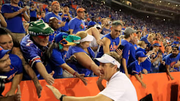 GAINESVILLE, FL - OCTOBER 06: Head coach Dan Mullen of the Florida Gators celebrates with fans following a 27-19 victory over the LSU Tigers at Ben Hill Griffin Stadium on October 6, 2018 in Gainesville, Florida. (Photo by Sam Greenwood/Getty Images)