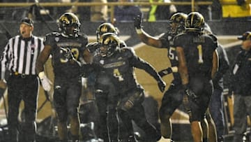 Nov 25, 2016; Kalamazoo, MI, USA; Western Michigan Broncos cornerback Darius Phillips (4) celebrates after an interception against the Toledo Rockets during the second half at Waldo Stadium. The Broncos won 55-35. Mandatory Credit: Patrick Gorski-USA TODAY Sports