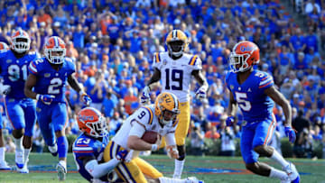 GAINESVILLE, FL - OCTOBER 06: Joe Burrow #9 of the LSU Tigers is tackled by Chauncey Gardner-Johnson #23 of the Florida Gators during the game at Ben Hill Griffin Stadium on October 6, 2018 in Gainesville, Florida. (Photo by Sam Greenwood/Getty Images)