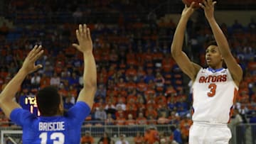 Mar 1, 2016; Gainesville, FL, USA; Florida Gators forward Devin Robinson (3) shoots a three over Kentucky Wildcats guard Isaiah Briscoe (13) during the first half at Stephen C. O