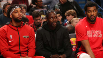 NEW ORLEANS, LA - JANUARY 6: Jahlil Okafor #8, Jrue Holiday #11, and Derrick Favors #22 of the New Orleans Pelicans watch the game against the Utah Jazz on January 6, 2020 at the Smoothie King Center in New Orleans, Louisiana. NOTE TO USER: User expressly acknowledges and agrees that, by downloading and or using this Photograph, user is consenting to the terms and conditions of the Getty Images License Agreement. Mandatory Copyright Notice: Copyright 2020 NBAE (Photo by Layne Murdoch Jr./NBAE via Getty Images)