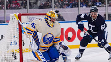 Mar 13, 2022; Hamilton, Ontario, CAN; Buffalo Sabres goaltender Craig Anderson (41) makes a save as Toronto Maple Leafs forward Michael Bunting (58) looks for a rebound in the 2022 Heritage Classic ice hockey game at Tim Hortons Field. Mandatory Credit: John E. Sokolowski-USA TODAY Sports
