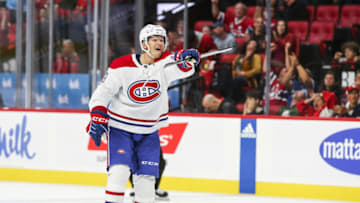OTTAWA, CANADA - OCTOBER 07: Mattias Norlinder #59 of the Montreal Canadiens celebrates Sean Monahan #91 (not in the image) goal in the third period of a preseason game against the Ottawa Senators at Canadian Tire Centre on October 07, 2023 in Ottawa, Canada. (Photo by Chris Tanouye/Freestyle Photography/Getty Images)
