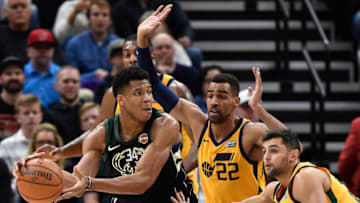 SALT LAKE CITY, UT - NOVEMBER 25: Giannis Antetokounmpo #34 of the Milwaukee Bucks controls the ball while being guarded by Thabo Sefolosha #22 of the Utah Jazz and teammate Raul Neto #25 during their game at Vivint Smart Home Arena on November 25, 2017 in Salt Lake City, Utah. (Photo by Gene Sweeney Jr./Getty Images)