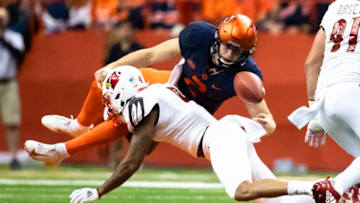 SYRACUSE, NY - NOVEMBER 09: Eric Dungey #2 of the Syracuse Orange fumbles but retains possession after being hit by TreSean Smith #4 of the Louisville Cardinals during a run in the third quarter at the Carrier Dome on November 9, 2018 in Syracuse, New York. (Photo by Brett Carlsen/Getty Images)