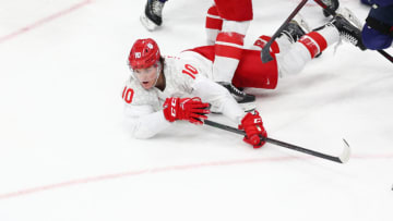 BEIJING, CHINA - FEBRUARY 20: Dmitri Voronkov #10 of Team ROC falls to the ice as he goes for the puck in the third period during the Men's Ice Hockey Gold Medal match between Team Finland and Team ROC on Day 16 of the Beijing 2022 Winter Olympic Games at National Indoor Stadium on February 20, 2022 in Beijing, China. (Photo by Elsa/Getty Images)