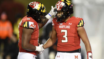 COLLEGE PARK, MARYLAND - NOVEMBER 20: Taulia Tagovailoa #3 of the Maryland Terrapins celebrates with Tayon Fleet-Davis #8 after scoring a two-point conversion in the second half against the Michigan Wolverines at Capital One Field at Maryland Stadium on November 20, 2021 in College Park, Maryland. (Photo by Greg Fiume/Getty Images)