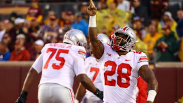 Sep 2, 2021; Minneapolis, Minnesota, USA; Ohio State Buckeyes running back Miyan Williams (28) reacts after scoring a touchdown during the first quarter against the Minnesota Gophers at Huntington Bank Stadium. Mandatory Credit: Harrison Barden-USA TODAY Sports