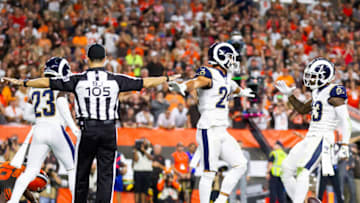 Sep 22, 2019; Cleveland, OH, USA; Los Angeles Rams safety Taylor Rapp (24) and strong safety John Johnson (43) celebrate as NFL back judge Dino Paganelli (105) signals an incomplete pass by the Cleveland Browns during the fourth quarter at FirstEnergy Stadium. The Rams won 20-13. Mandatory Credit: Scott R. Galvin-USA TODAY Sports