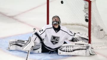May 21, 2014; Chicago, IL, USA; Los Angeles Kings goalie Jonathan Quick (32) looks up at the puck after making a save against Chicago Blackhawks defenseman Brent Seabrook (not pictured) during the second period in game two of the Western Conference Final of the 2014 Stanley Cup Playoffs at United Center. Mandatory Credit: Jerry Lai-USA TODAY Sports
