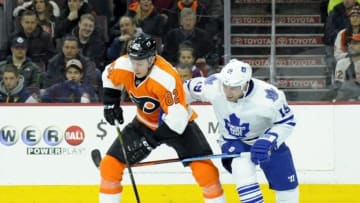 Jan 19, 2016; Philadelphia, PA, USA; Philadelphia Flyers defenseman Evgeny Medvedev (82) trees to clear the puck against Toronto Maple Leafs right wing Joffrey Lupul (19) during the first period at Wells Fargo Center. Mandatory Credit: Eric Hartline-USA TODAY Sports