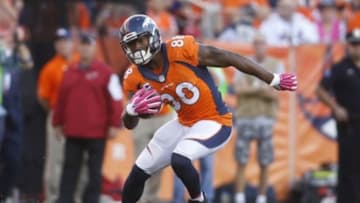Oct 5, 2014; Denver, CO, USA; Denver Broncos wide receiver Demaryius Thomas (88) runs with the ball after catching a pass during the first half against the Arizona Cardinals at Sports Authority Field at Mile High. The Broncos won 41-20. Mandatory Credit: Chris Humphreys-USA TODAY Sports