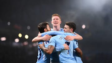 MANCHESTER, ENGLAND - DECEMBER 16: Kevin De Bruyne of Manchester City congratulates Raheem Sterling after scoring the fourth goal duringduring the Premier League match between Manchester City and Tottenham Hotspur at Etihad Stadium on December 16, 2017 in Manchester, England. (Photo by Laurence Griffiths/Getty Images)