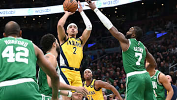 Dec 21, 2022; Boston, Massachusetts, USA; Indiana Pacers guard Andrew Nembhard (2) attempts a shot against Boston Celtics guard Jaylen Brown (7) during the second quarter at the TD Garden. Mandatory Credit: Brian Fluharty-USA TODAY Sports