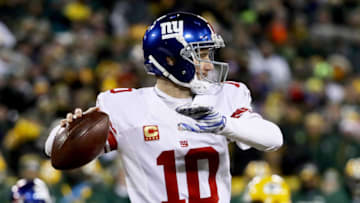 GREEN BAY, WI - JANUARY 8: Eli Manning #10 of the New York Giants throws a pass in the fourth quarter during the NFC Wild Card game against the Green Bay Packers at Lambeau Field on January 8, 2017 in Green Bay, Wisconsin. (Photo by Jonathan Daniel/Getty Images)