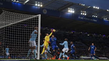 LEICESTER, ENGLAND - NOVEMBER 18: Ederson of Manchester City punches clear of Vicente Iborra of Leicester City during the Premier League match between Leicester City and Manchester City at The King Power Stadium on November 18, 2017 in Leicester, England. (Photo by Michael Regan/Getty Images)