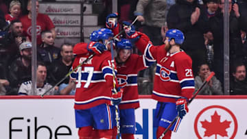 MONTREAL, QC - APRIL 06: Ryan Poehling #25 of the Montreal Canadiens celebrates his first career NHL goal in his first game at 11:41 of the first period and is joined by Jordan Weal #43, Brett Kulak #17 and Jeff Petry #26 against the Toronto Maple Leafs at the Bell Centre on April 6, 2019 in Montreal, Quebec, Canada. The Montreal Canadiens defeated the Toronto Maple Leafs 6-5 in a shootout. (Photo by Minas Panagiotakis/Getty Images)