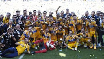 Tigres players pose with the Liga MX Champions Cup trophy after defeating Pachuca 2-1 on Sunday. (Photo by Kevork Djansezian/Getty Images)