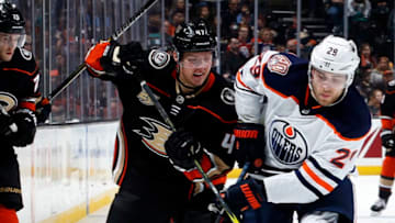 ANAHEIM, CA - JANUARY 6: Leon Draisaitl #29 of the Edmonton Oilers battles for the puck against Hampus Lindholm #47 of the Anaheim Ducks during the game on January 6, 2018 at Honda Center in Anaheim, California. (Photo by Debora Robinson/NHLI via Getty Images)