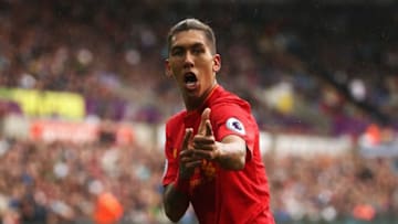 SWANSEA, WALES - OCTOBER 01: Roberto Firmino of Liverpool celebrates scoring his sides first goal during the Premier League match between Swansea City and Liverpool at Liberty Stadium on October 1, 2016 in Swansea, Wales. (Photo by Julian Finney/Getty Images)