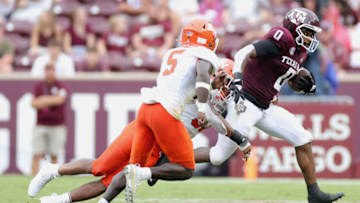 COLLEGE STATION, TEXAS - SEPTEMBER 03: Ainias Smith #0 of the Texas A&M Aggies rushes ahead of Darrel Hawkins-Williams #5 of the Sam Houston State Bearkats during the second half at Kyle Field on September 03, 2022 in College Station, Texas. (Photo by Carmen Mandato/Getty Images)