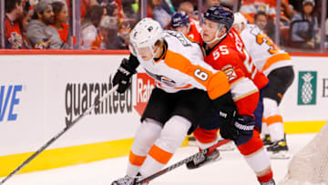 Mar 10, 2022; Sunrise, Florida, USA; Philadelphia Flyers defenseman Travis Sanheim (6) protects the puck from Florida Panthers center Noel Acciari (55) during the third period at FLA Live Arena. Mandatory Credit: Sam Navarro-USA TODAY Sports