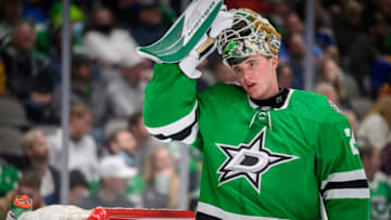 Dec 14, 2021; Dallas, Texas, USA; Dallas Stars goaltender Jake Oettinger (29) adjusts his mask during a stoppage in the game against the St. Louis Blues at the American Airlines Center. Mandatory Credit: Jerome Miron-USA TODAY Sports