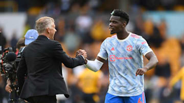 WOLVERHAMPTON, ENGLAND - AUGUST 29: Paul Pogba of Manchester United celebrates with Ole Gunnar Solskjaer, Manager of Manchester United following the Premier League match between Wolverhampton Wanderers and Manchester United at Molineux on August 29, 2021 in Wolverhampton, England. (Photo by Michael Regan/Getty Images)