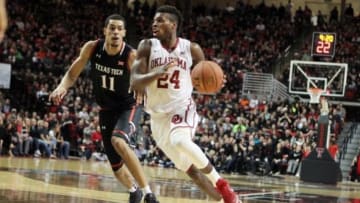 Feb 17, 2016; Lubbock, TX, USA; Oklahoma Sooners guard Buddy Hield (24) drives the ball around Texas Tech Red Raiders forward Zach Smith (11) in the second half at United Supermarkets Arena. Texas Tech defeated Oklahoma 65-63. Mandatory Credit: Michael C. Johnson-USA TODAY Sports