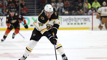 Jan 8, 2023; Anaheim, California, USA; Boston Bruins right wing David Pastrnak (88) controls the puck during the first period against the Anaheim Ducks at Honda Center. Mandatory Credit: Jason Parkhurst-USA TODAY Sports