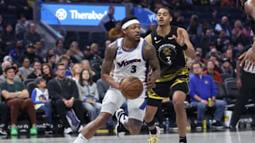 SAN FRANCISCO, CALIFORNIA - FEBRUARY 13: Bradley Beal #3 of the Washington Wizards drives to the basket against Jordan Poole #3 of the Golden State Warriors in the third quarter at Chase Center on February 13, 2023 in San Francisco, California. NOTE TO USER: User expressly acknowledges and agrees that, by downloading and/or using this photograph, User is consenting to the terms and conditions of the Getty Images License Agreement. (Photo by Lachlan Cunningham/Getty Images)