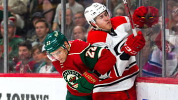ST. PAUL, MN - APRIL 04: Minnesota Wild right wing Nino Niederreiter (22) checks Carolina Hurricanes left wing Teuvo Teravainen (86) along the boards in the 2nd period during the game between the Carolina Hurricanes and the Minnesota Wild on April 4, 2017 at Xcel Energy Center in St. Paul, Minnesota. (Photo by David Berding/Icon Sportswire via Getty Images)