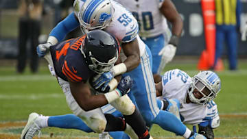 CHICAGO, IL - NOVEMBER 19: Jordan Howard #24 of the Chicago Bears is hit by Tavon Wilson #32 (R) and Tahir Whitehead #59 of the Detroit Lions at Soldier Field on November 19, 2017 in Chicago, Illinois. The Lions defeated the Bears 27-24. (Photo by Jonathan Daniel/Getty Images)