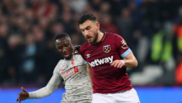 LONDON, ENGLAND - FEBRUARY 04: Naby Keita of Liverpool battles for possession with Robert Snodgrass of West Ham United during the Premier League match between West Ham United and Liverpool FC at London Stadium on February 04, 2019 in London, United Kingdom. (Photo by Catherine Ivill/Getty Images)