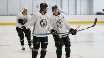 BOSTON - SEPTEMBER 4: Boston Bruins' Anders Bjork, left, and Zach Senyshyn joke as they warm up during captain's practice at Warrior Ice Arena in the Brighton neighborhood of Boston on Sep. 4, 2019. (Photo by Jessica Rinaldi/The Boston Globe via Getty Images)