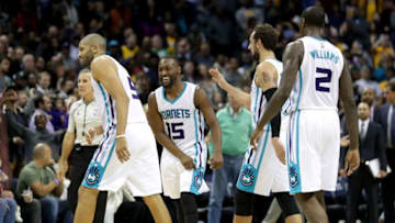 CHARLOTTE, NC - DECEMBER 20: Teammate Kemba Walker