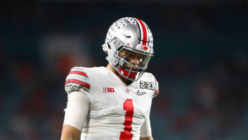 Jan 11, 2021; Miami Gardens, Florida, USA; Ohio State Buckeyes quarterback Justin Fields (1) reacts against the Alabama Crimson Tide in the 2021 CFP National Championship Game. Mandatory Credit: Mark J. Rebilas-USA TODAY Sports