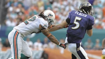 MIAMI, FL - JANUARY 4: Quarterback Joe Flacco #5 of the Baltimore Ravens rushes from the pocket against the Miami Dolphins in an NFL Wildcard Playoff Game at Dolphins Stadium on January 4, 2009 in Miami, Florida. (Photo by Al Messerschmidt/Getty Images)