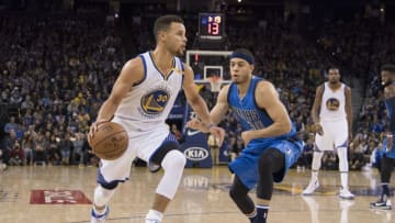 December 30, 2016; Oakland, CA, USA; Golden State Warriors guard Stephen Curry (30, left) dribbles the basketball against Dallas Mavericks guard Seth Curry (30, right) during the third quarter at Oracle Arena. The Warriors defeated the Mavericks 108-99. Mandatory Credit: Kyle Terada-USA TODAY Sports