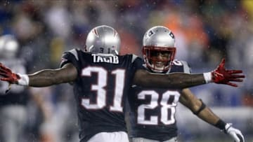 Sep 12, 2013; Foxborough, MA, USA; New England Patriots cornerback Aqib Talib (31) celebrates an interception against the New York Jets with strong safety Steve Gregory (28) during the second half at Gillette Stadium. Mandatory Credit: Mark L. Baer-USA TODAY Sports