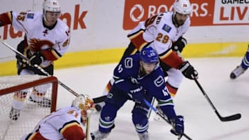 Oct 15, 2016; Vancouver, British Columbia, CAN; Vancouver Canucks forward Sven Baertschi (47) moves the puck against Calgary Flames goaltender Chad Johnson (31) during the third period at Rogers Arena. The Vancouver Canucks won 2-1 in a shootout. Mandatory Credit: Anne-Marie Sorvin-USA TODAY Sports