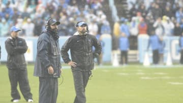 Oct 8, 2016; Chapel Hill, NC, USA; North Carolina Tar Heels head coach Larry Fedora, right, on the field in the first half at Kenan Memorial Stadium. Mandatory Credit: Bob Donnan-USA TODAY Sports