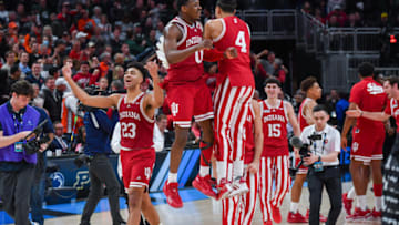 INDIANAPOLIS, INDIANA - MARCH 11: Players of the Indiana Hoosiers celebrate after beating the Illinois Fighting Illini in a Men's Big Ten Tournament Quarterfinals game at Gainbridge Fieldhouse on March 11, 2022 in Indianapolis, Indiana. The Indiana Hoosiers won the game 65-63 over the Illinois Fighting Illini. (Photo by Aaron J. Thornton/Getty Images)