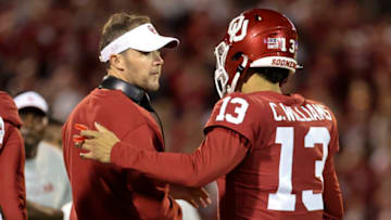 Oct 16, 2021; Norman, Oklahoma, USA; Oklahoma Sooners quarterback Caleb Williams (13) celebrates with Oklahoma Sooners head coach Lincoln Riley after a touchdown during the second half against the TCU Horned Frogs at Gaylord Family-Oklahoma Memorial Stadium. Mandatory Credit: Kevin Jairaj-USA TODAY Sports