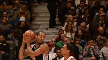 TORONTO, ON - FEBRUARY 8: Kawhi Leonard #2 of the San Antonio Spurs handles the ball against DeMar DeRozan #10 of the Toronto Raptors on February 8, 2015 at the Air Canada Centre in Toronto, Ontario, Canada. NOTE TO USER: User expressly acknowledges and agrees that, by downloading and or using this Photograph, user is consenting to the terms and conditions of the Getty Images License Agreement. Mandatory Copyright Notice: Copyright 2015 NBAE (Photo by Ron Turenne/NBAE via Getty Images)