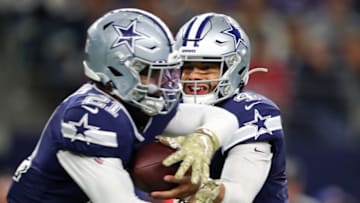 ARLINGTON, TEXAS - NOVEMBER 10: Dak Prescott #4 of the Dallas Cowboys hands off to Ezekiel Elliott #21 during the first half against the Minnesota Vikings at AT&T Stadium on November 10, 2019 in Arlington, Texas. (Photo by Tom Pennington/Getty Images)