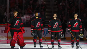 Apr 2, 2023; Raleigh, North Carolina, USA; Carolina Hurricanes goaltender Frederik Andersen (31) defenseman Jalen Chatfield (5) defenseman Shayne Gostisbehere (41) and center Paul Stastny (26) look on before the game against the New York Islanders at PNC Arena. Mandatory Credit: James Guillory-USA TODAY Sports