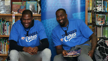 OKLAHOMA CITY, OK - FEBRUARY 5: Kevin Durant #35 and Kendrick Perkins #5 of the Oklahoma City Thunder read a book to students and lead them in the Read to Achieve pledge as part of the Thunder Reading Timeout, presented by American Fidelity Assurance Company on February 5, 2015 at the Washington Irving Elementary School in Oklahoma City, Oklahoma. NOTE TO USER: User expressly acknowledges and agrees that, by downloading and or using this Photograph, user is consenting to the terms and conditions of the Getty Images License Agreement. Mandatory Copyright Notice: Copyright 2015 NBAE (Photo by Layne Murdoch/NBAE via Getty Images)
