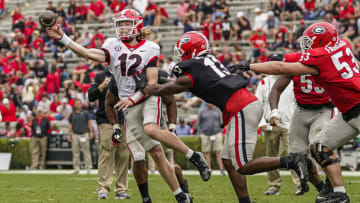 Apr 16, 2022; Athens, Georgia, USA; Georgia Bulldogs quarterback Brock Vandagriff (12) passes under pressure from defensive lineman Mykel Williams (13) during the Georgia Bulldogs Spring Game at Sanford Stadium. Mandatory Credit: Dale Zanine-USA TODAY Sports